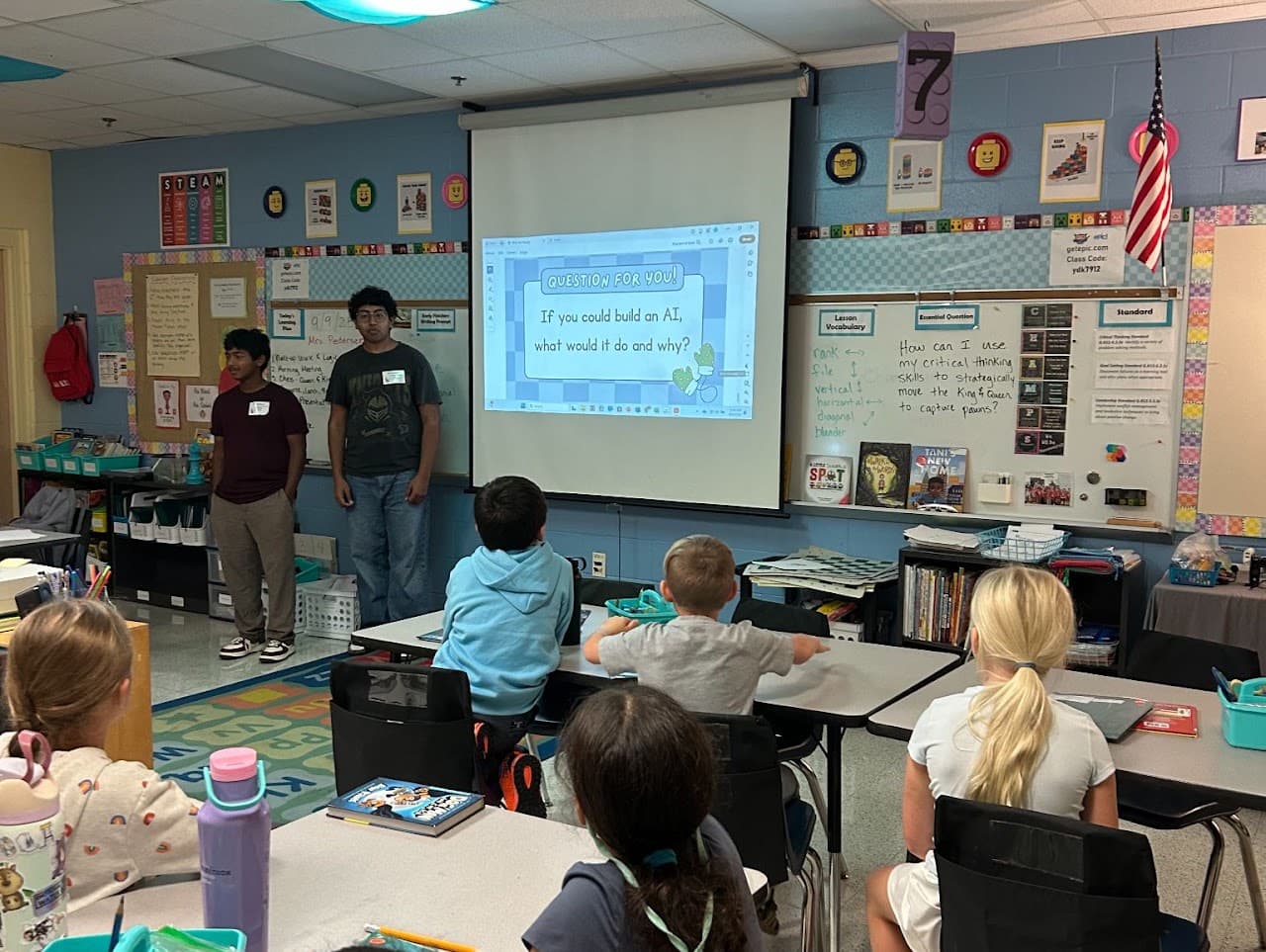Elementary school students listening to an AIforALL presentation in their classroom