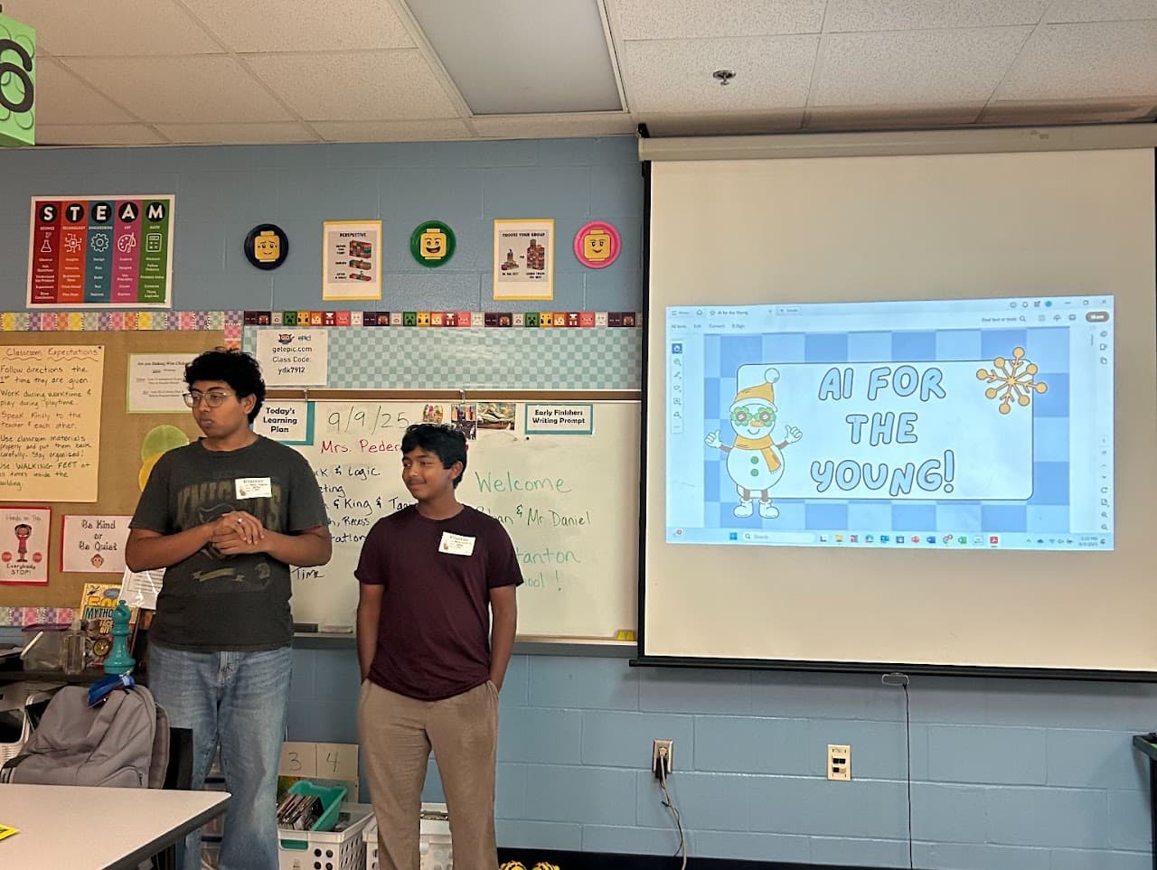 AIforALL volunteers introducing an AI for the Young session to an elementary school classroom